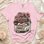 Pink t-shirt with "Just Hitched & Unsupervised" graphic and retro car scene.