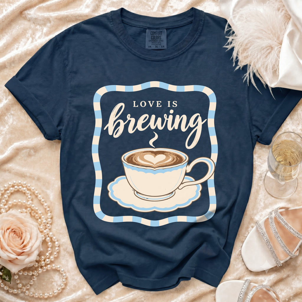 Navy t-shirt with "Love is Brewing" text and coffee cup graphic.