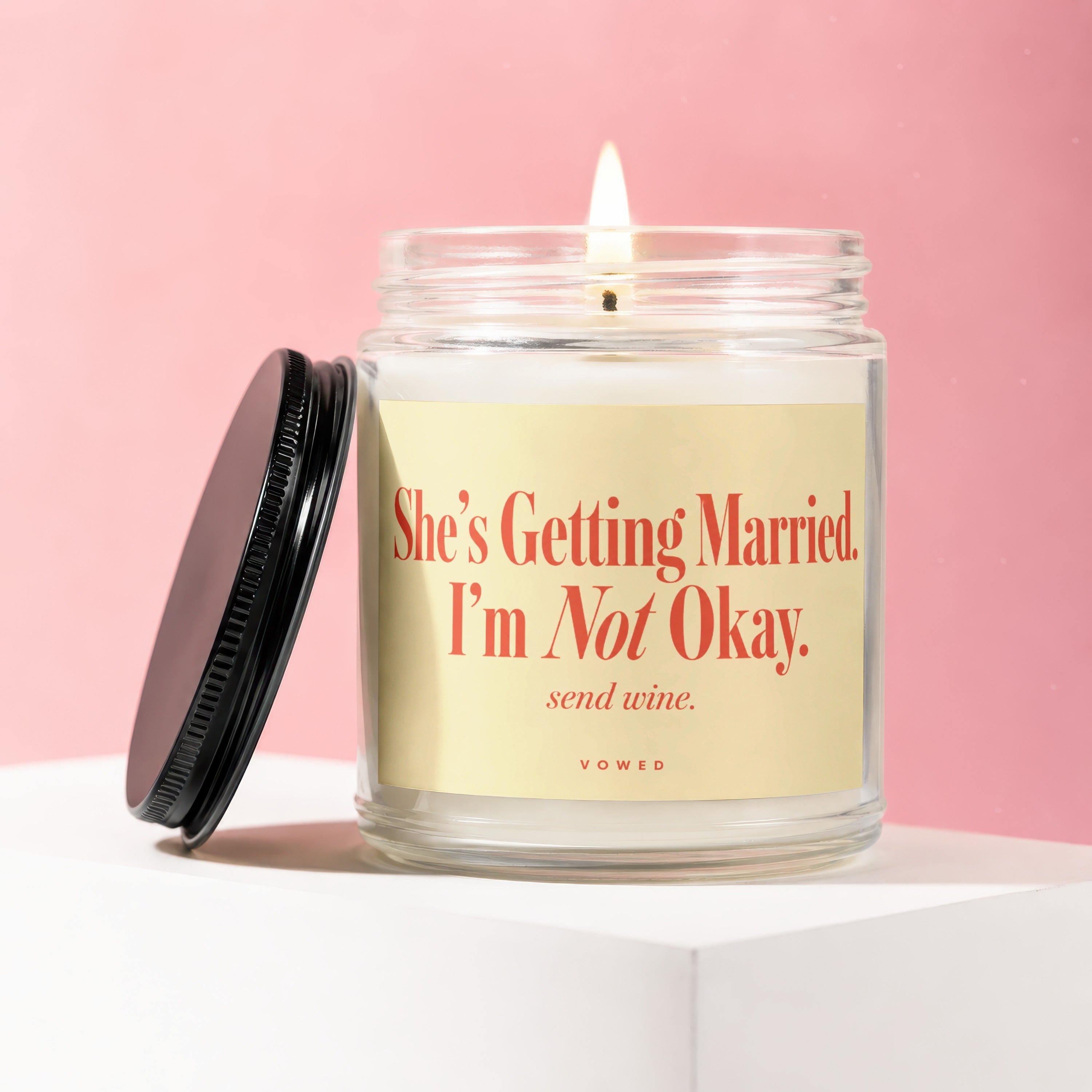 Candle with "She's Getting Married. I'm Not Okay. send wine." text.