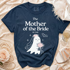 A dark blue t-shirt printed with white text reading The Mother of the Bride by Par, featuring a ghost bride illustration.