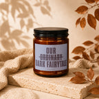 Amber candle with label reading "OUR ORDINARY DARK FAIRYTALE VOWED".