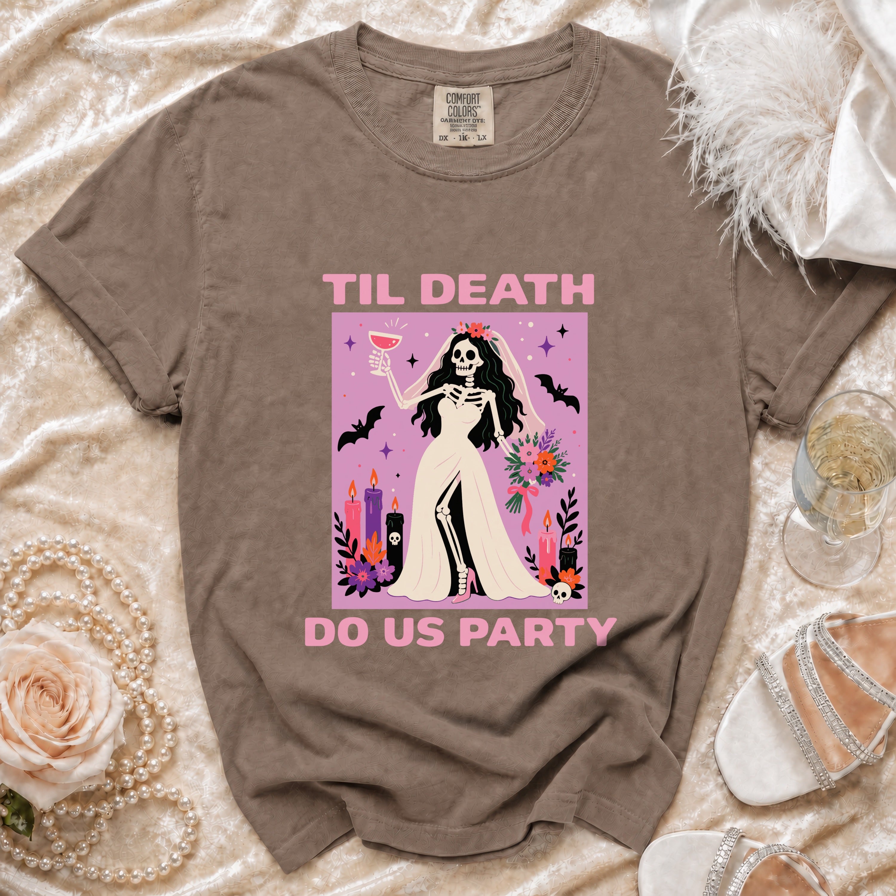 Brown t-shirt with skeleton bride graphic that reads "Til Death Do Us Party".