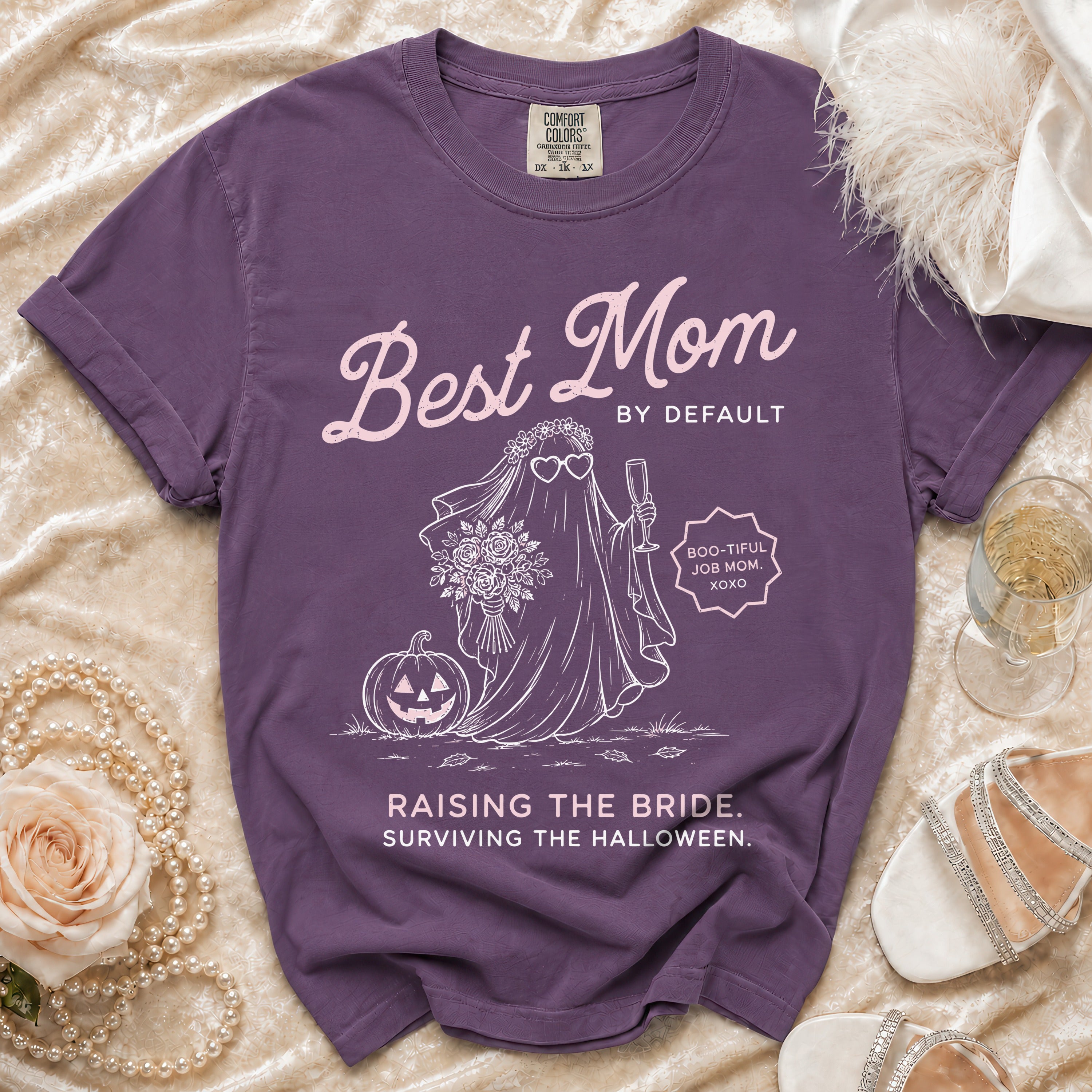 Purple Comfort Colors t-shirt with "Best Mom By Default" and Halloween ghost bride graphic.