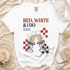 White t-shirt with "Red, White & I Do Bachelorette" text and champagne glasses.