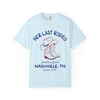 Light blue t-shirt with cowboy hat, boots, and "Her Last Rodeo" text.