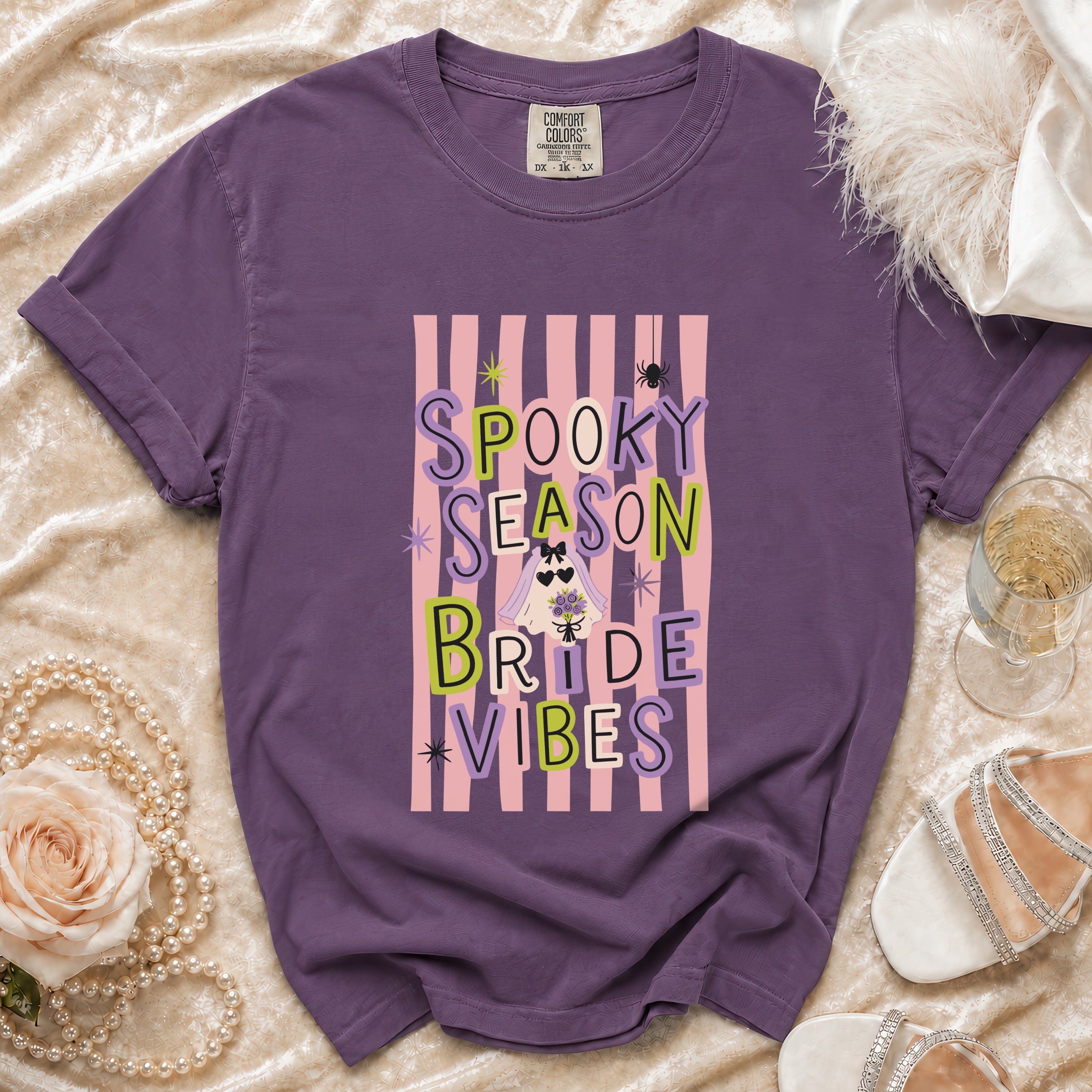 Purple t-shirt with "Spooky Season Bride Vibes" text and Halloween graphics.