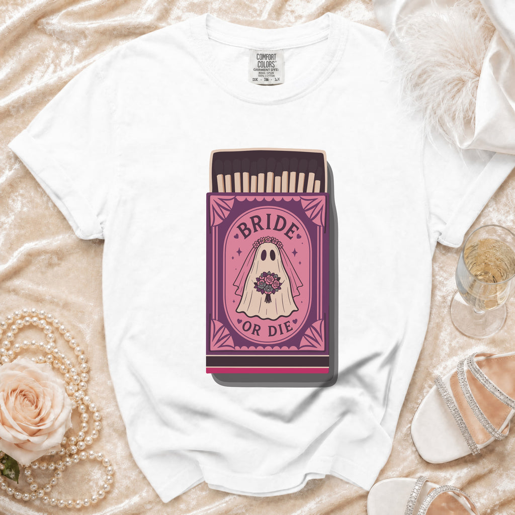 White t-shirt with a "Bride or Die" ghost graphic on a matchbox.