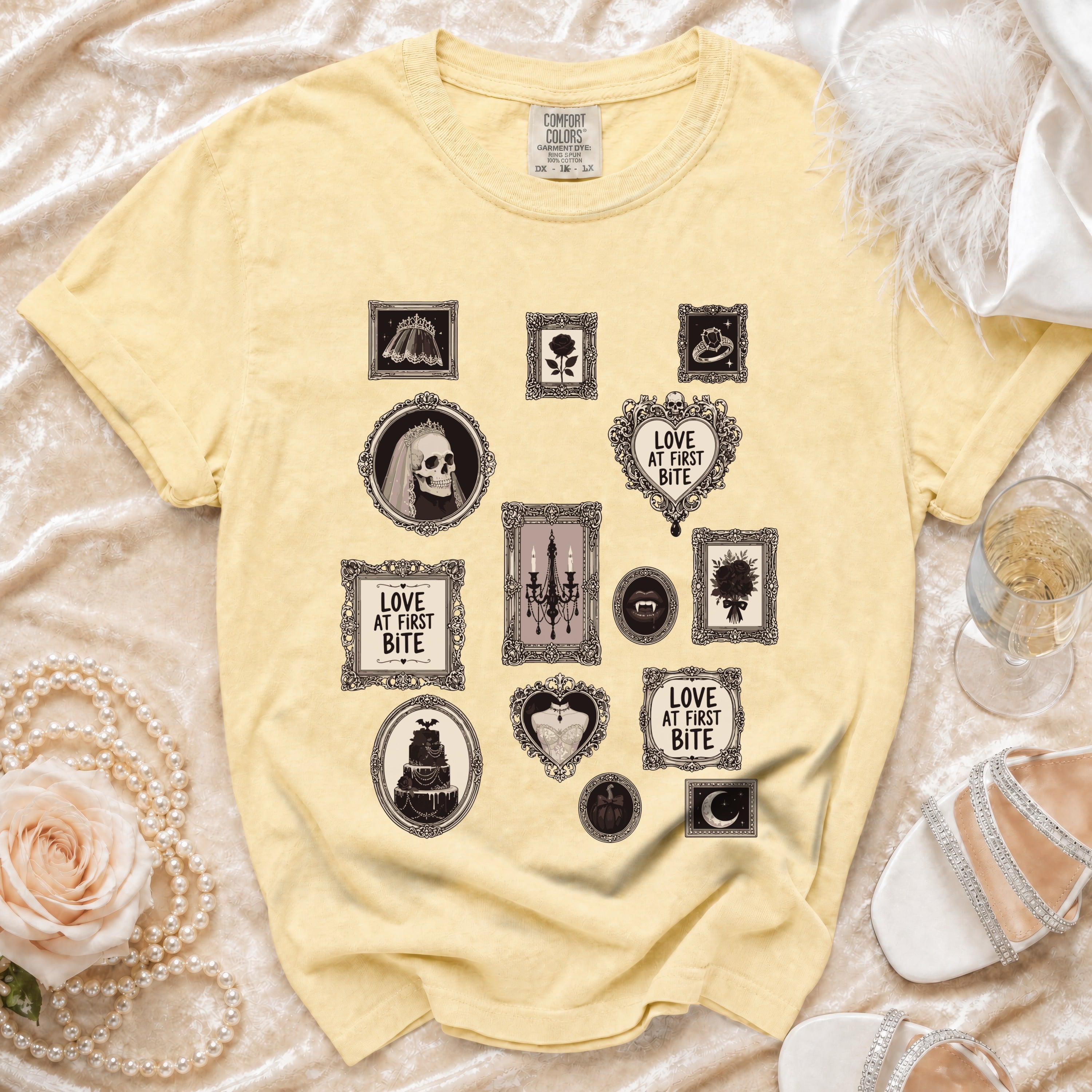 Yellow Comfort Colors t-shirt with gothic wedding-themed icons and "Love at First Bite" text.