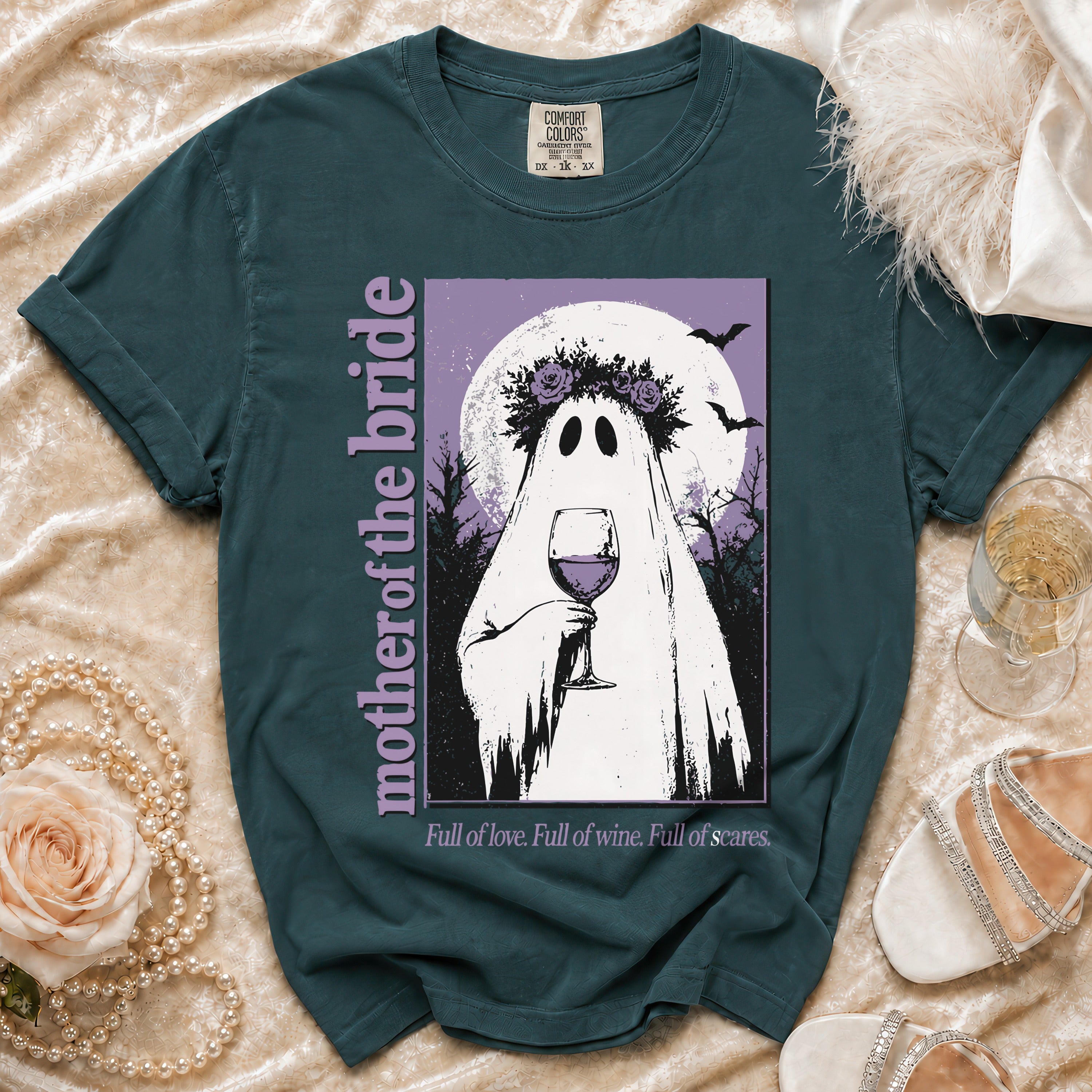 Teal t-shirt with a ghost holding wine, "mother of the bride" text, and quote.