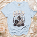 Light blue Comfort Colors t-shirt with "Bride After Dark" and skeleton bride graphic.
