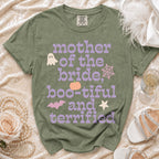 Green t-shirt with text "mother of the bride, boo-tiful and terrified" and Halloween icons.