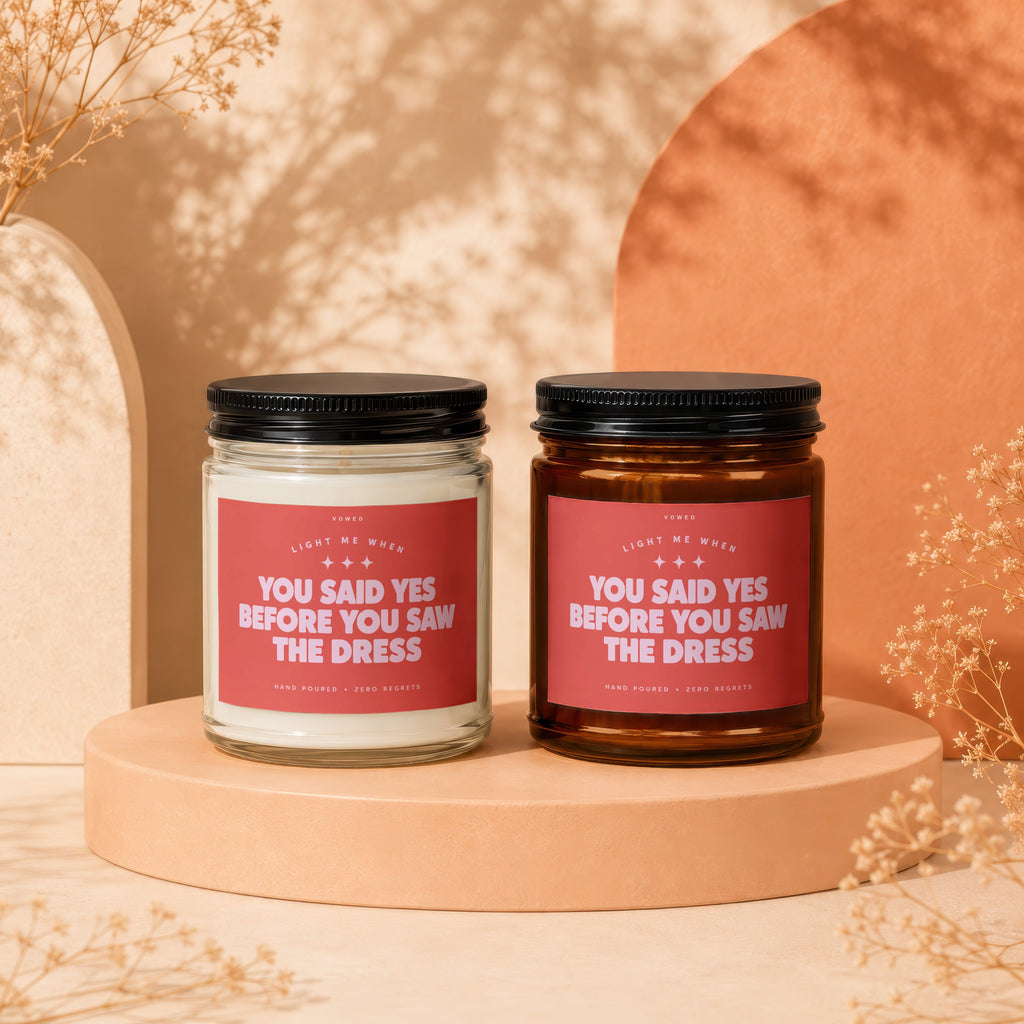Two candles with labels reading "You said yes before you saw the dress."