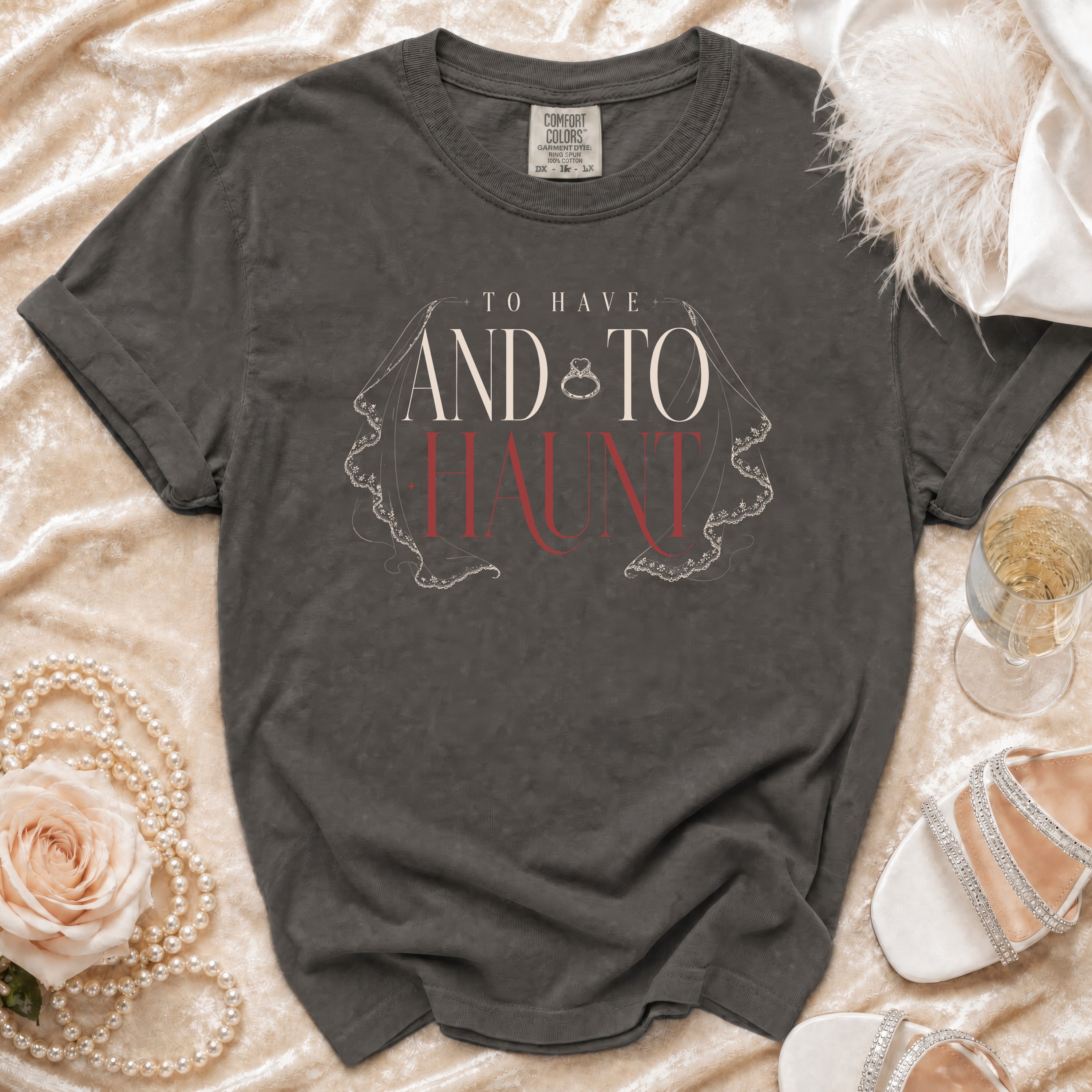Dark gray t-shirt with "To Have And To Haunt" text and wedding ring graphic.