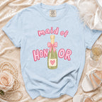 Light blue t-shirt with "maid of HONOR" text and champagne bottle graphic.
