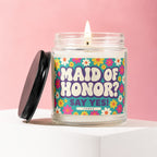 Glass candle with a floral label reading "Maid of Honor? Say Yes!"