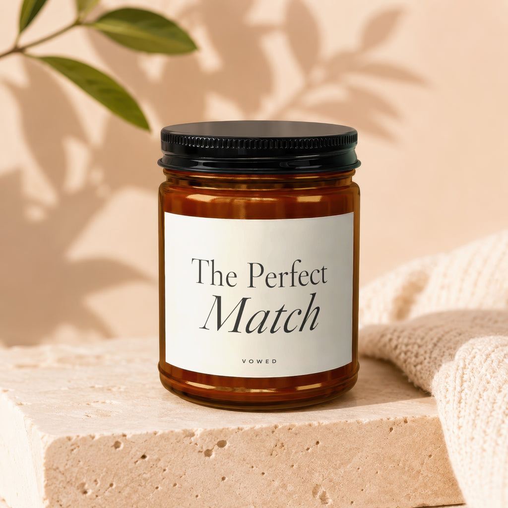 Amber glass jar candle: "The Perfect Match" with "VOWED" below.