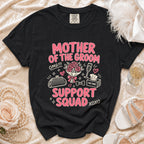 Black t-shirt with "Mother of the Groom Support Squad" graphic and wedding icons.