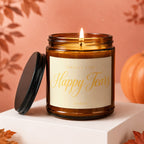 Amber glass candle with lit wick, label reads "Smells like Happy Tears Vowed".