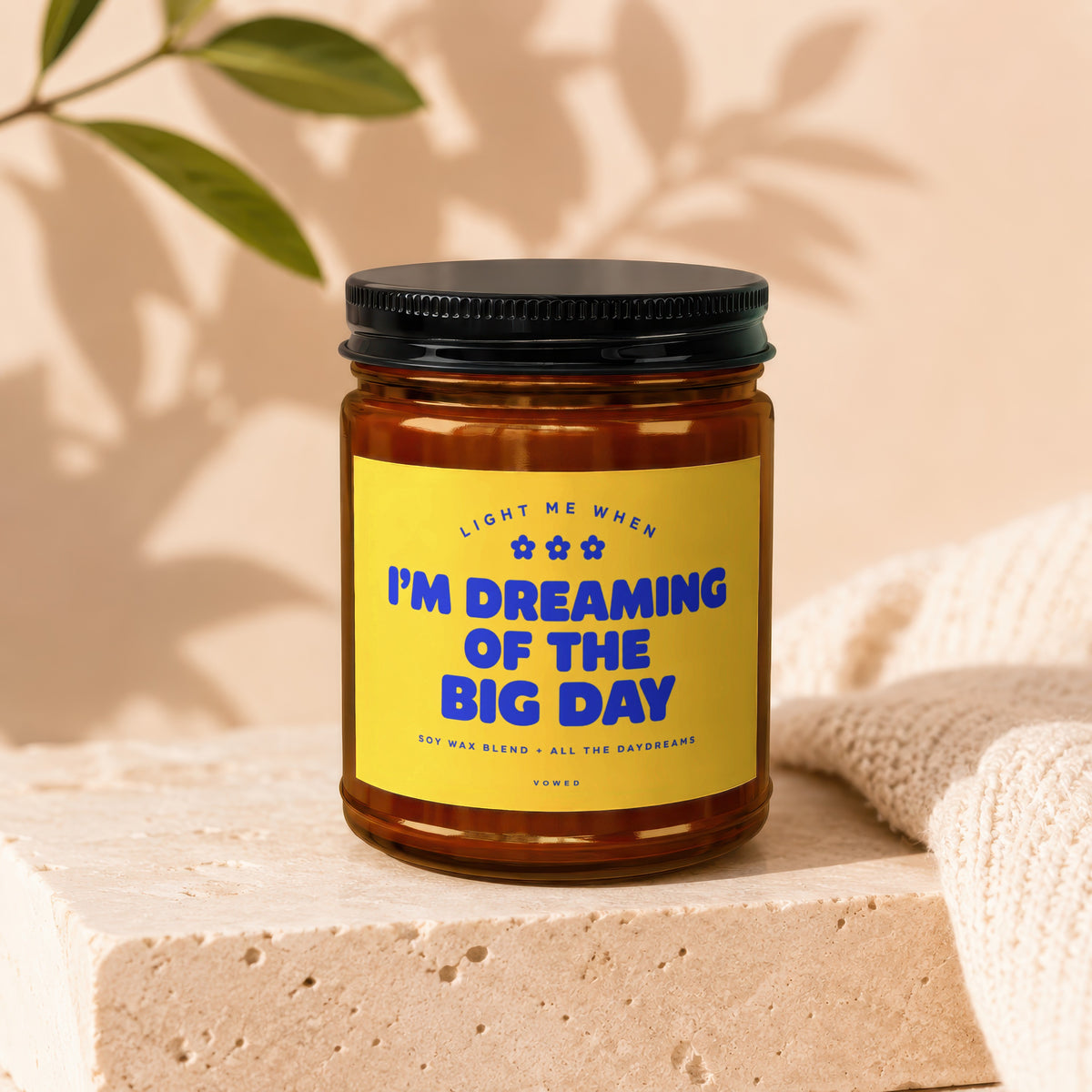 Amber jar candle with yellow label: "I'M DREAMING OF THE BIG DAY."