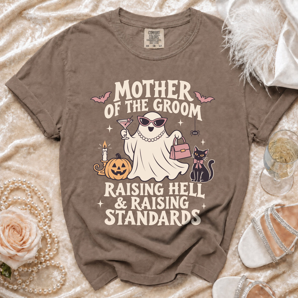 Brown t-shirt with "Mother of the Groom Raising Hell & Raising Standards" graphic.