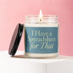 Glass candle with lit wick on white block, black lid next to it. Text: "I Have a Spreadsheet for That".