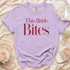 Lavender t-shirt with "This Bride Bites" text and Comfort Colors tag.