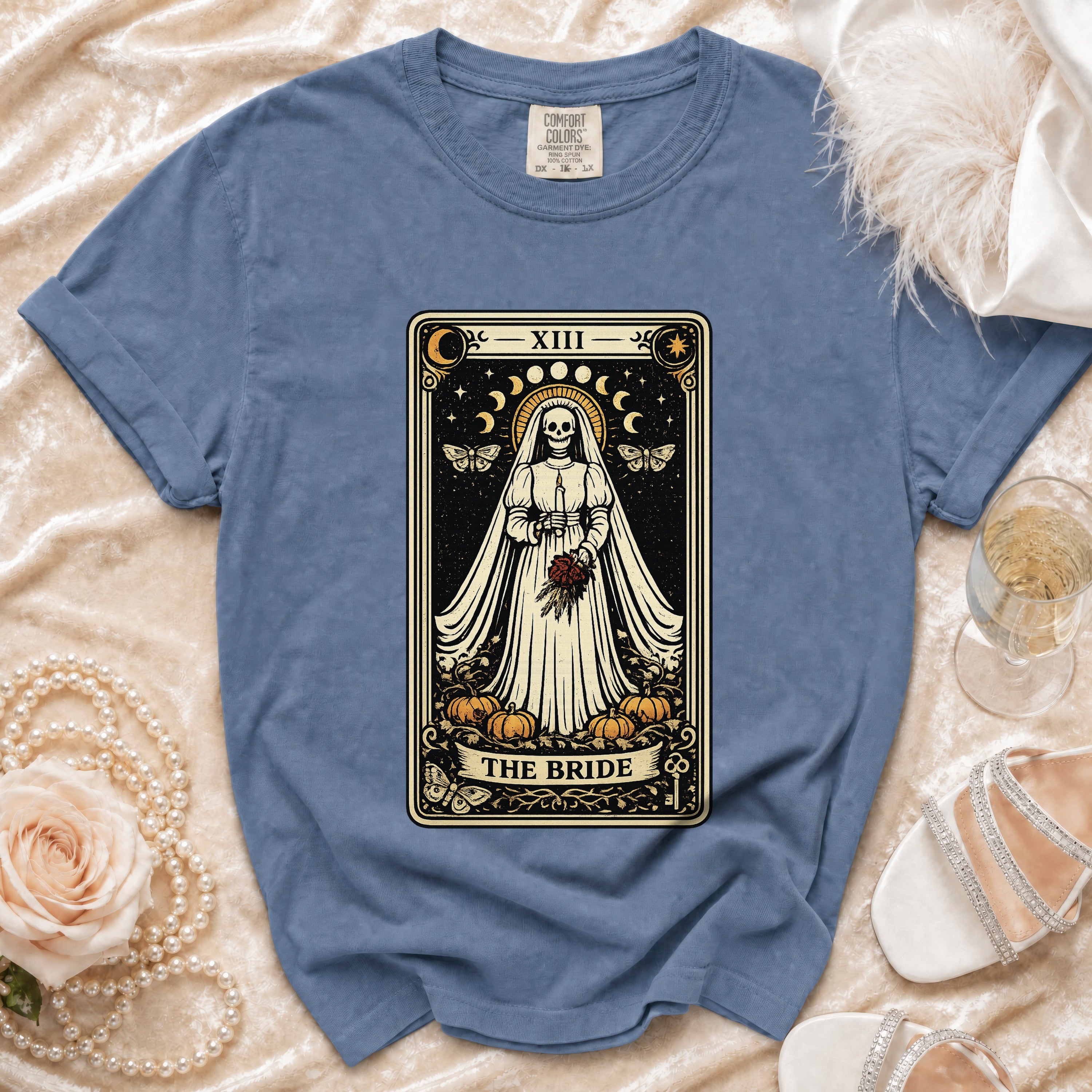 T-shirt with skeleton bride tarot card design and "The Bride" text.