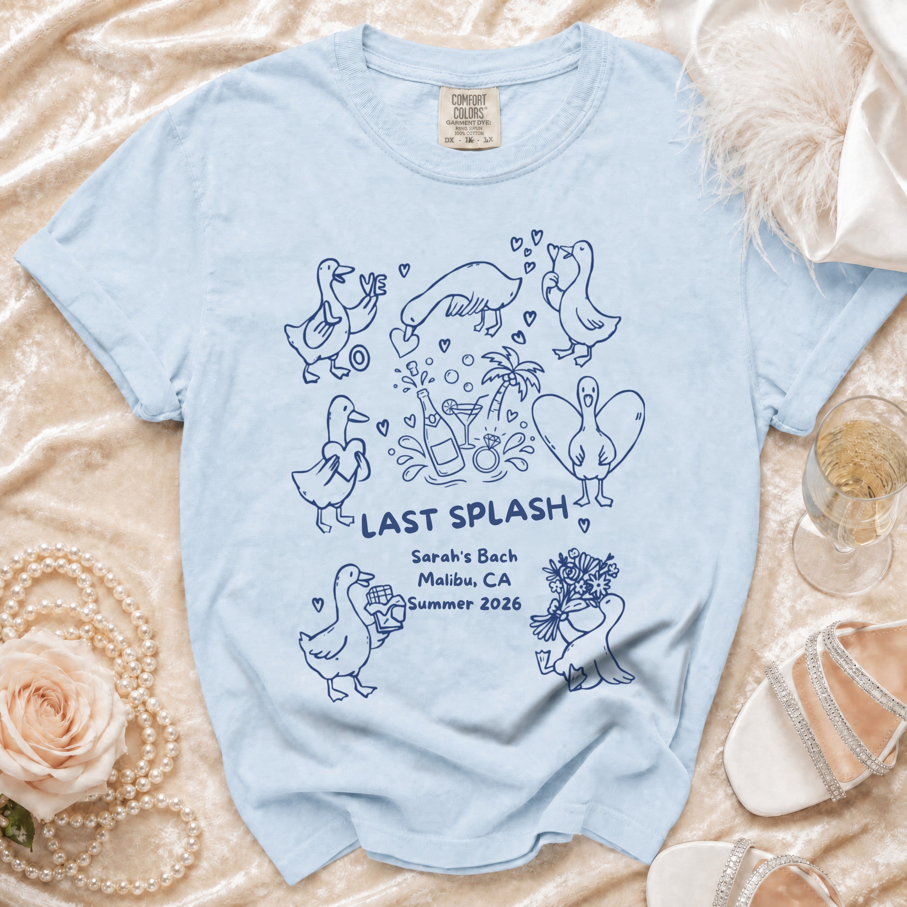 Light blue t-shirt with "Last Splash" and duck illustrations.