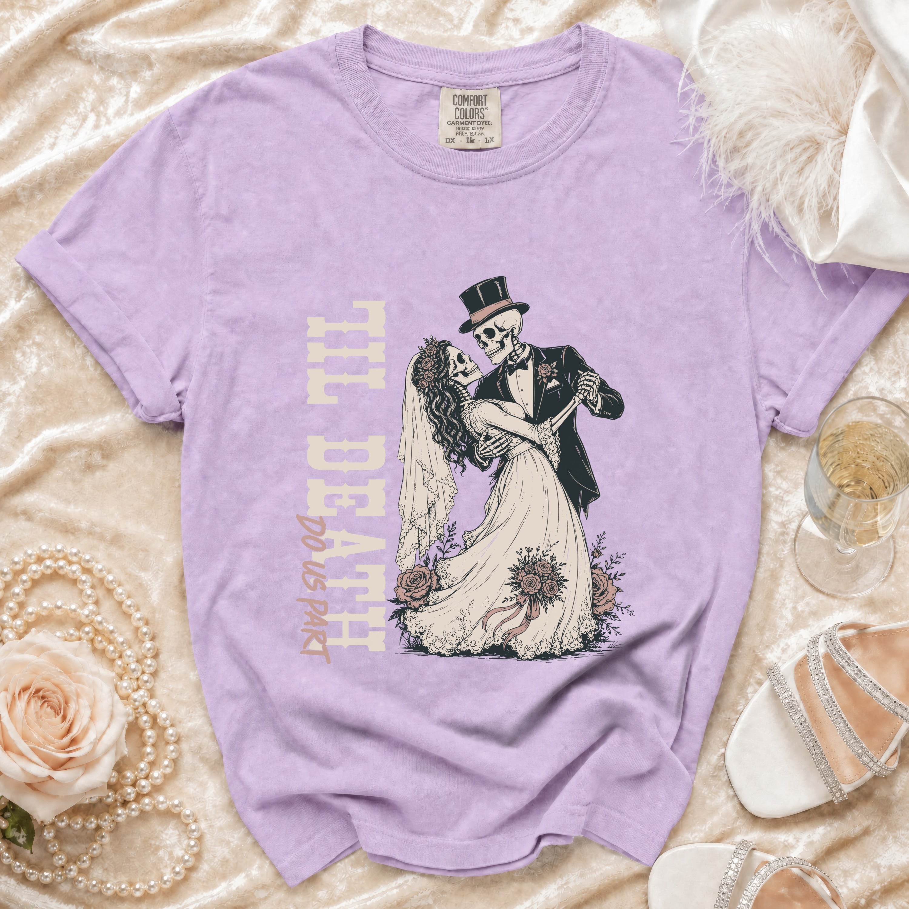 Purple t-shirt with skeleton bride and groom dancing, text reads "Til Death Do Us Part".