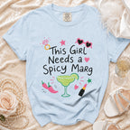 Light blue t-shirt with "This Girl Needs a Spicy Marg" text and graphics.