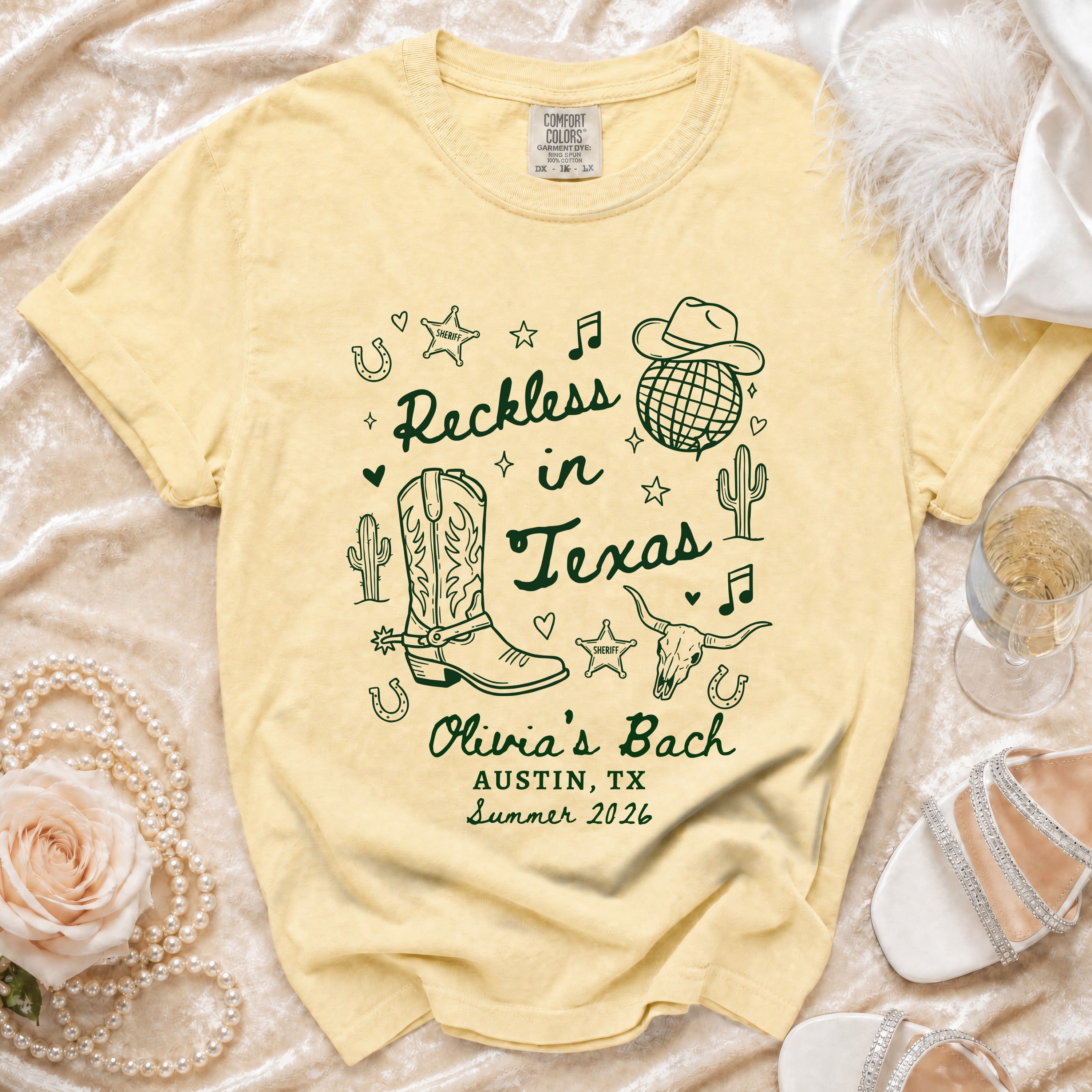 Yellow t-shirt with "Reckless in Texas" design, cowboy boots, and sheriff star.