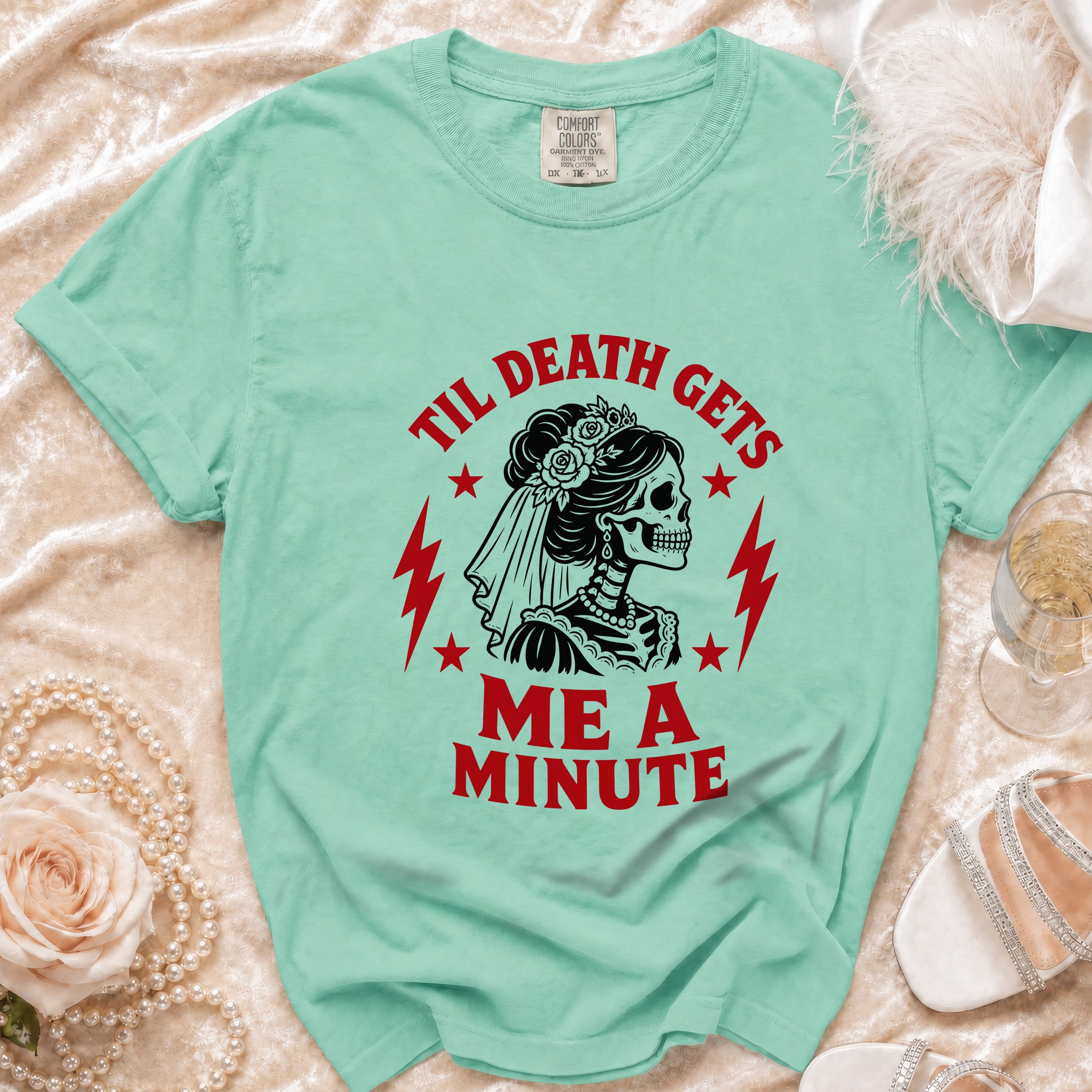 Teal t-shirt with "Til Death Gets Me A Minute" and skeleton bride graphic.
