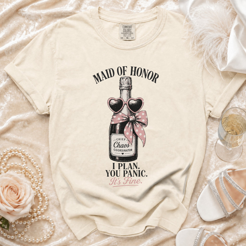 Cream t-shirt with "Maid of Honor" and champagne bottle graphic.