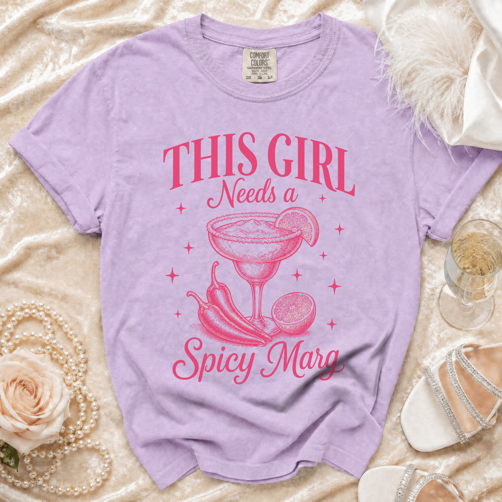 Purple t-shirt with "This Girl Needs a Spicy Marg" graphic and margarita.