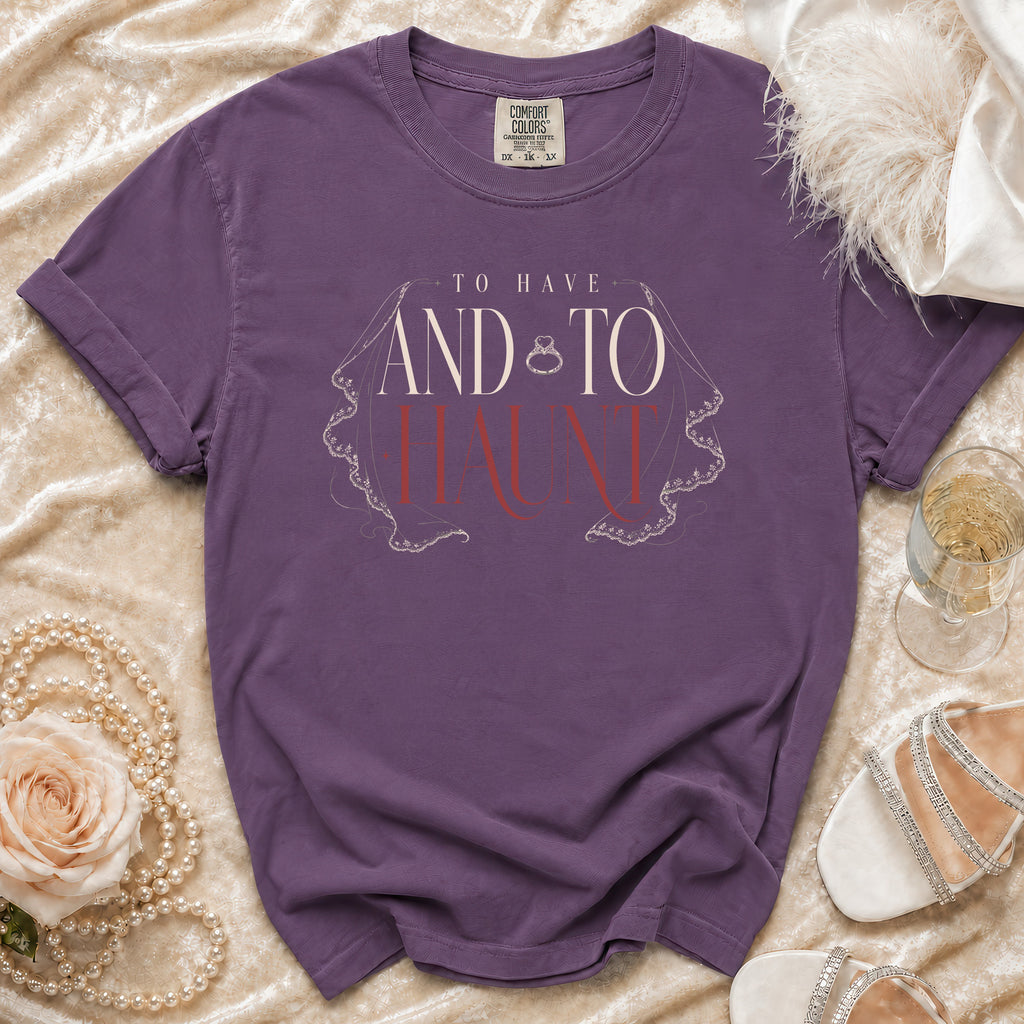 Purple t-shirt with "To Have And To Haunt" text and wedding veil graphic.