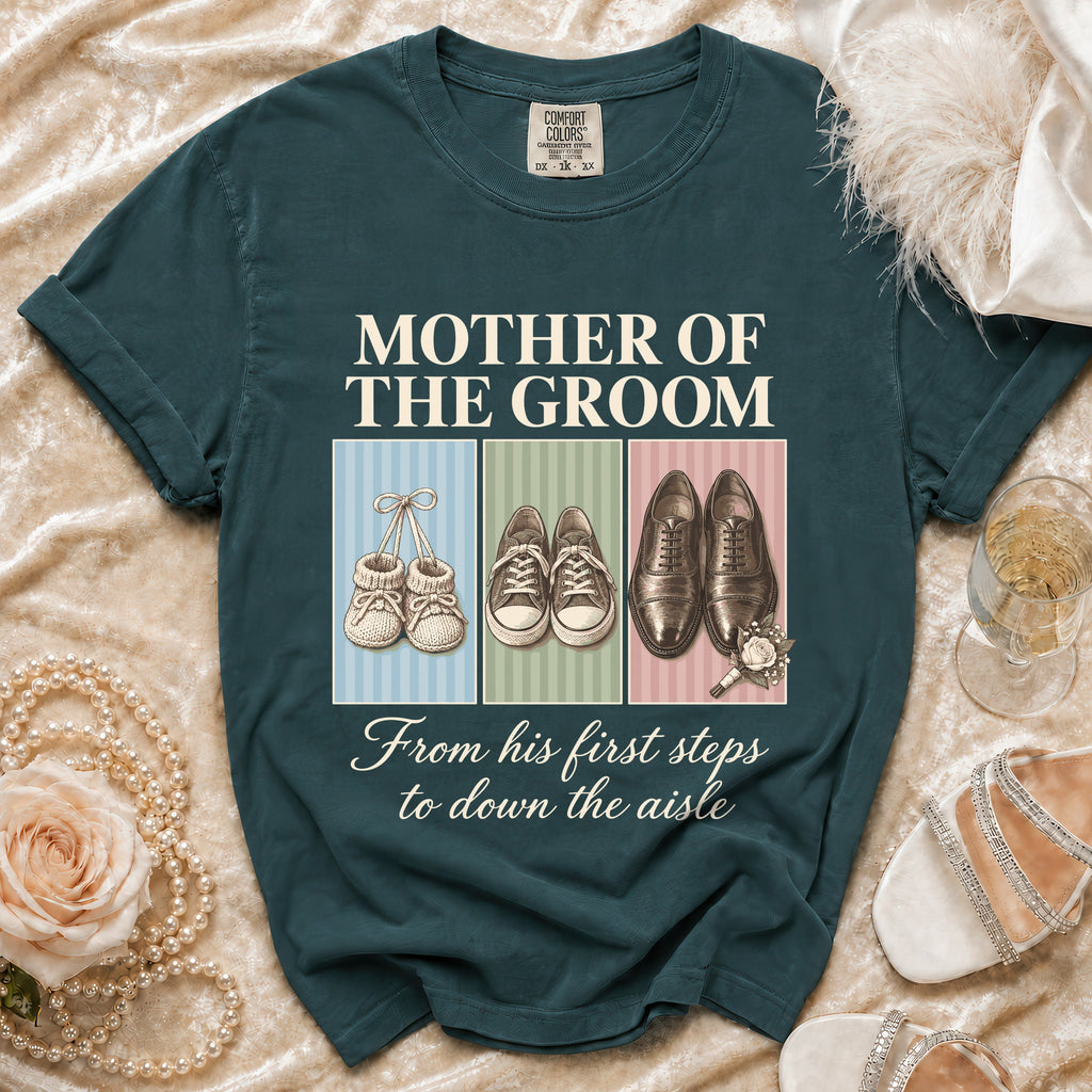 Teal t-shirt with "Mother of the Groom" text and three shoe illustrations: baby booties, sneakers, dress shoes.