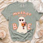 T-shirt with ghost, heart sunglasses, flowers, and "mother of the BAE" text.