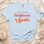 Light blue t-shirt with text "SPRITZ SOCIAL CLUB This Bride needs a Spritz".