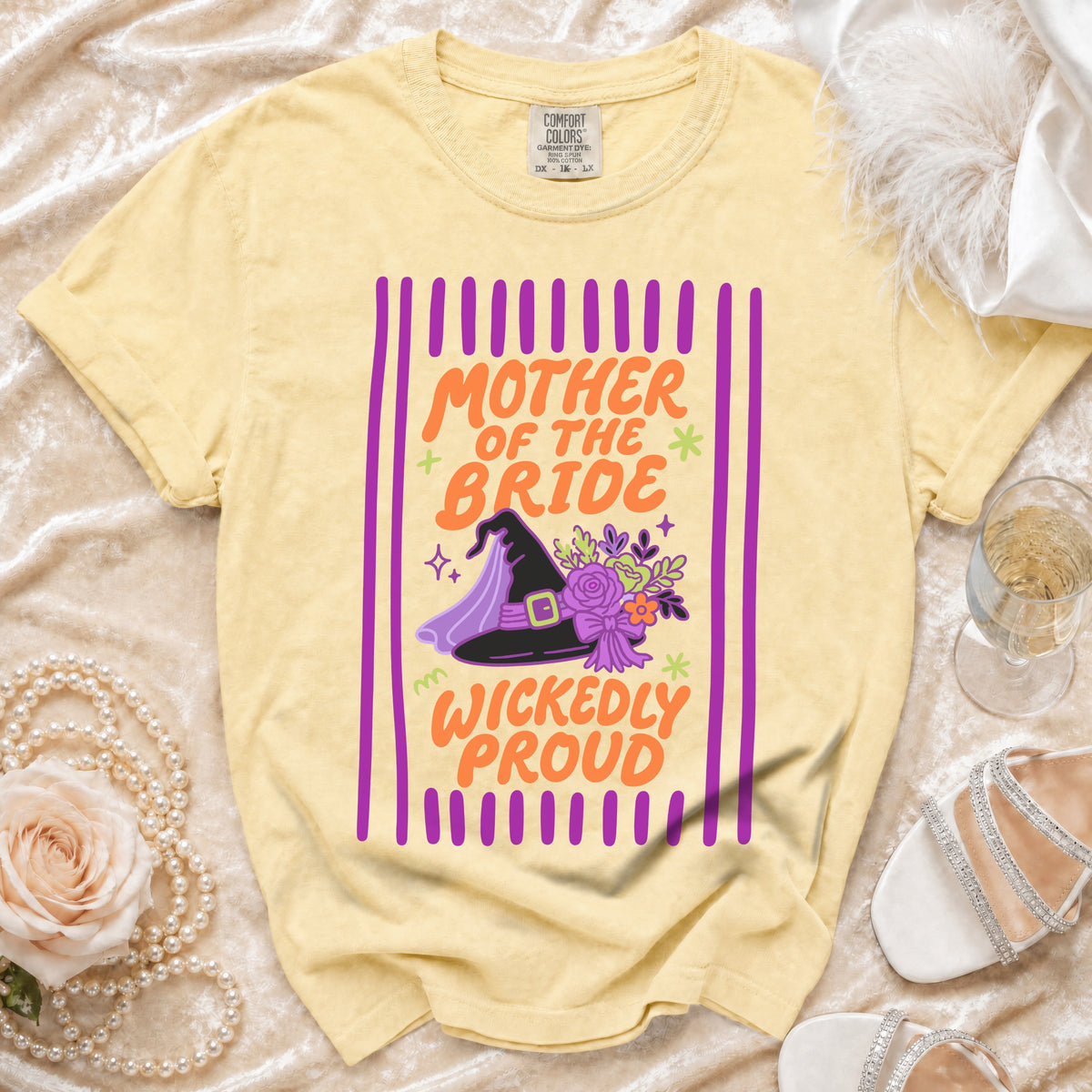 Yellow t-shirt with "Mother of the Bride Wickedly Proud" text and witch hat design.