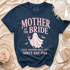 Navy t-shirt with "Mother of the Bride Raising Hell Since Day One" text and a ghost graphic.