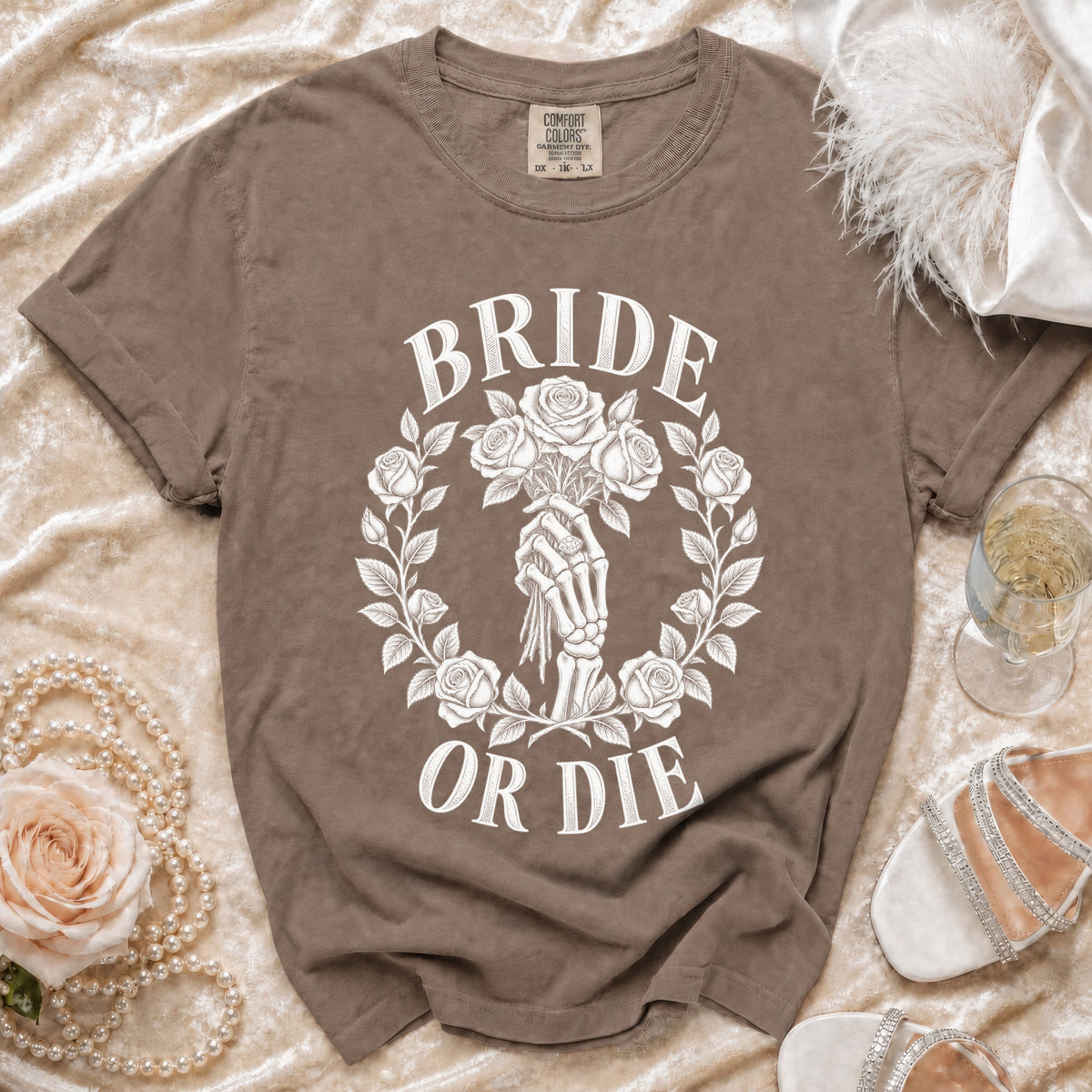 T-shirt with white "BRIDE OR DIE" text, skeleton hand holding roses.