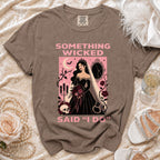 Brown t-shirt graphic with bride, skull, and text "Something wicked said 'I do'".