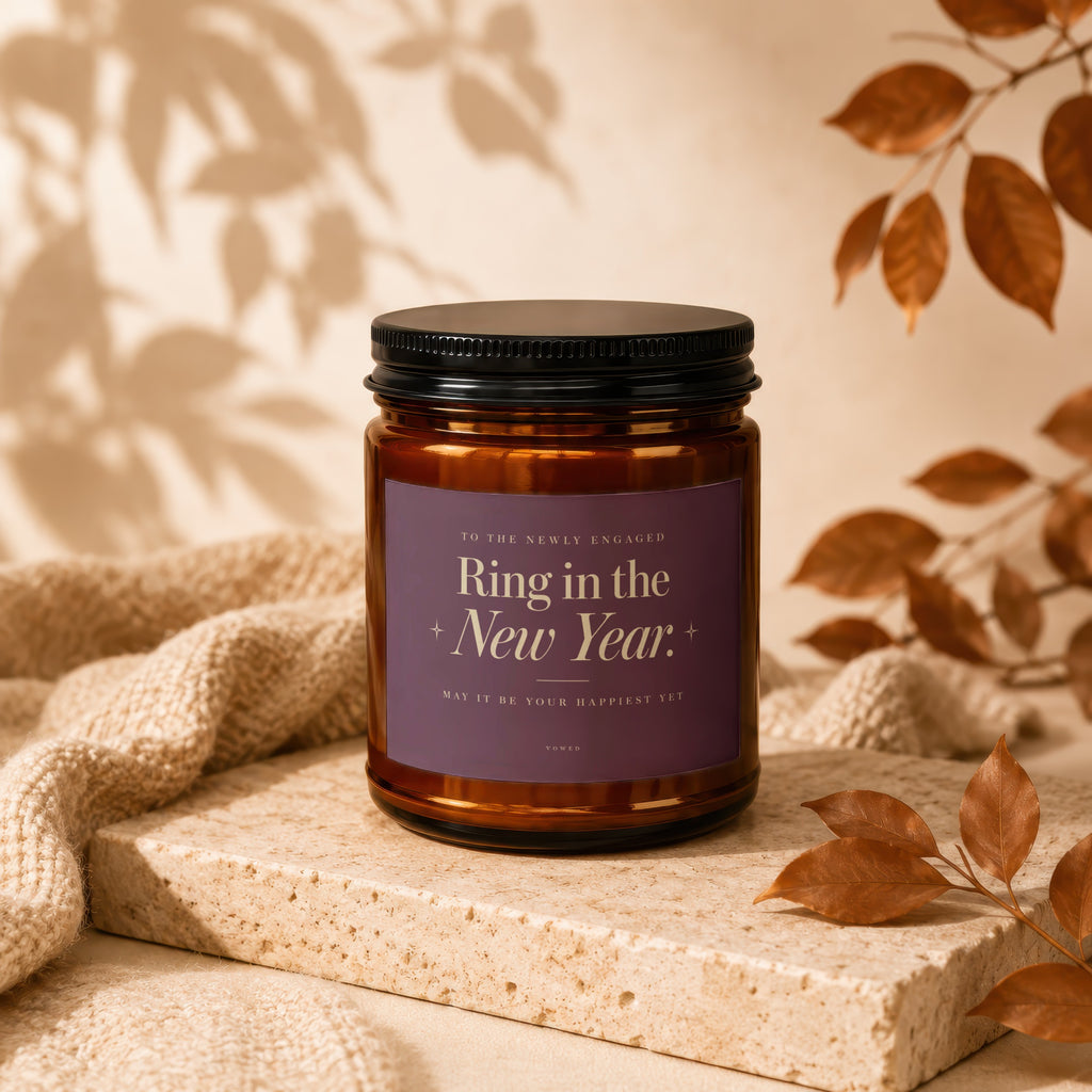 Candle for the newly engaged reading "Ring in the New Year."