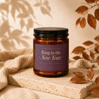 Candle for the newly engaged reading "Ring in the New Year."