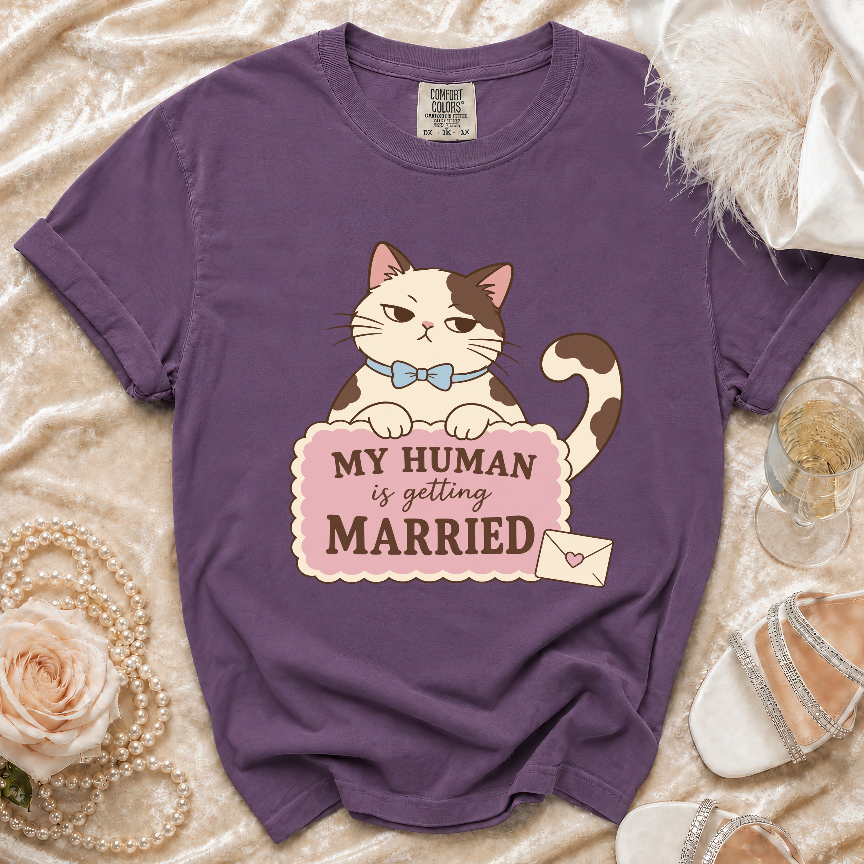 Purple t-shirt with a cartoon cat saying "My Human is Getting Married".