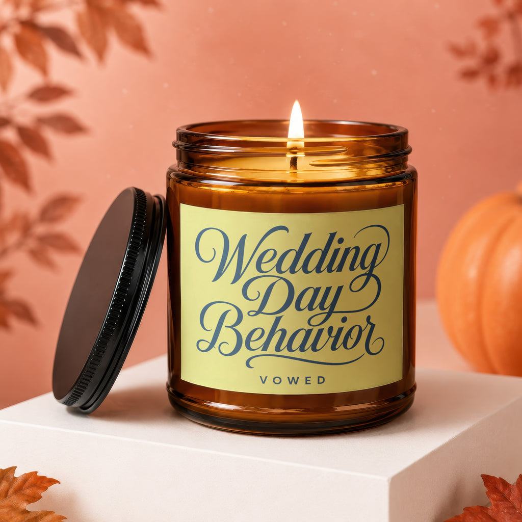 Amber glass candle with lit wick and lid off, text says "Wedding Day Behavior VOWED".