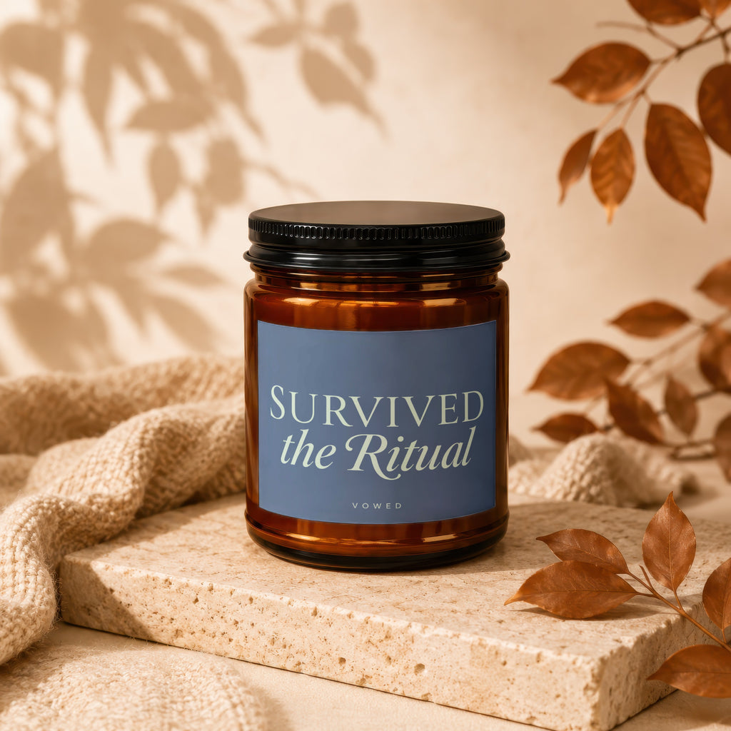 Brown glass candle with black lid, text "SURVIVED the Ritual VOWED".