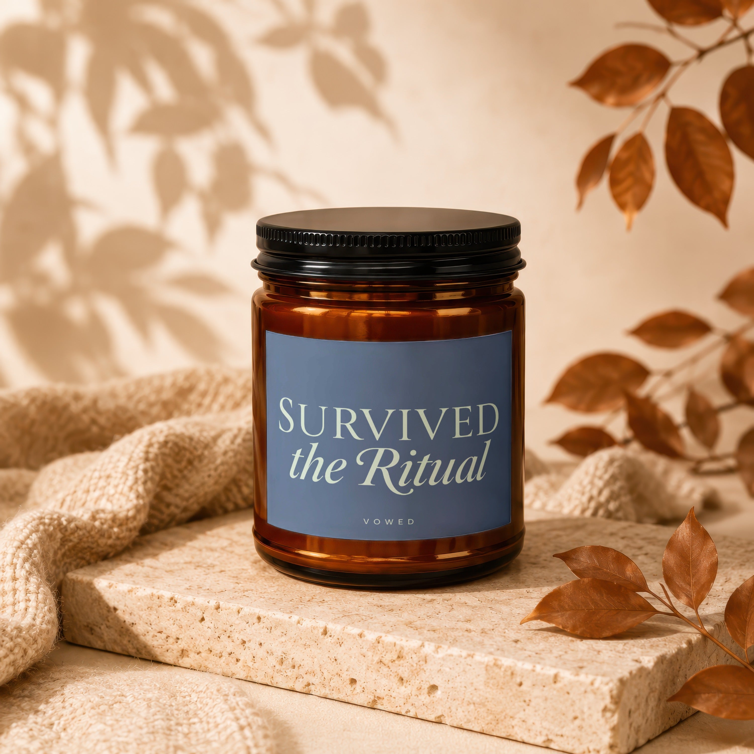 Brown glass candle with black lid, text "SURVIVED the Ritual VOWED".