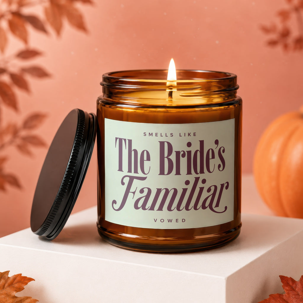 Lit candle in amber jar with "The Bride's Familiar Vowed" label.