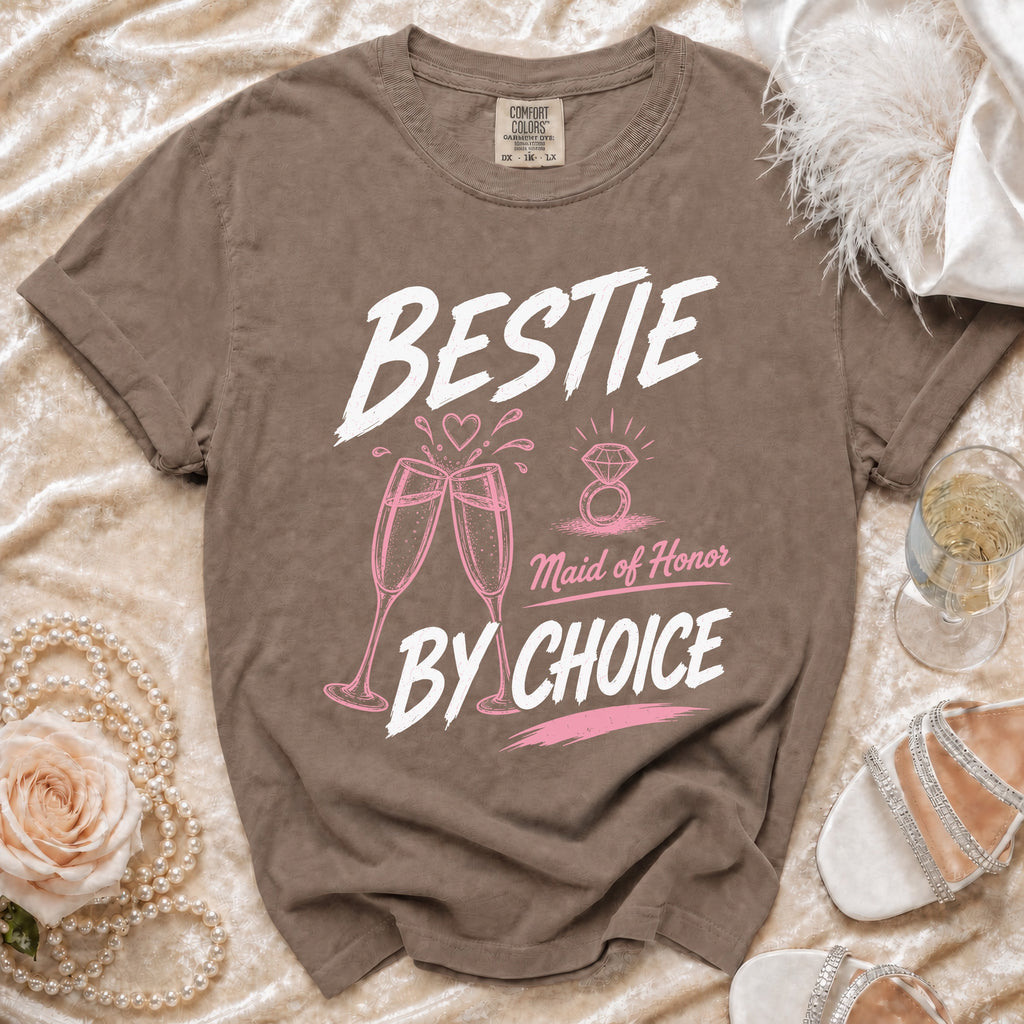 Brown t-shirt with "BESTIE Maid of Honor BY CHOICE" text, champagne glasses, and ring graphic.